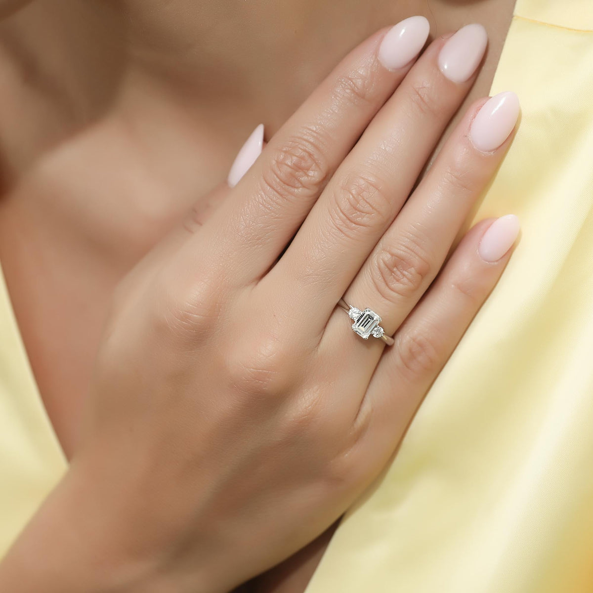 Sterling Silver 3-Stone Emerald Cut Cubic Zirconia Ring, Rhodium Plated Size 4.5 D11204